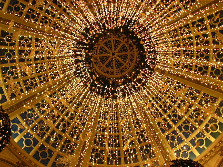 Golden Christmas Lights in Ornate Glass Dome Ceiling