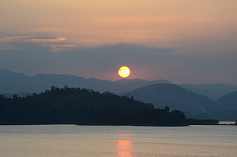 Sunset over Kaeng Krachan Lake with Silhouetted Mountains