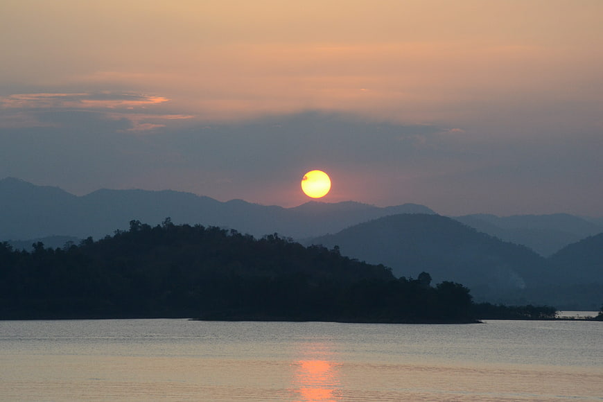 Sunset over Kaeng Krachan Lake with Silhouetted Mountains