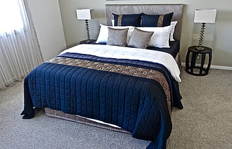 Modern Bedroom with Navy Blue Bedding and Striped Headboard