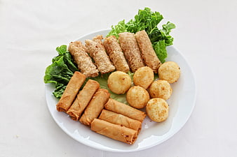 Assorted fried durian snacks on white plate