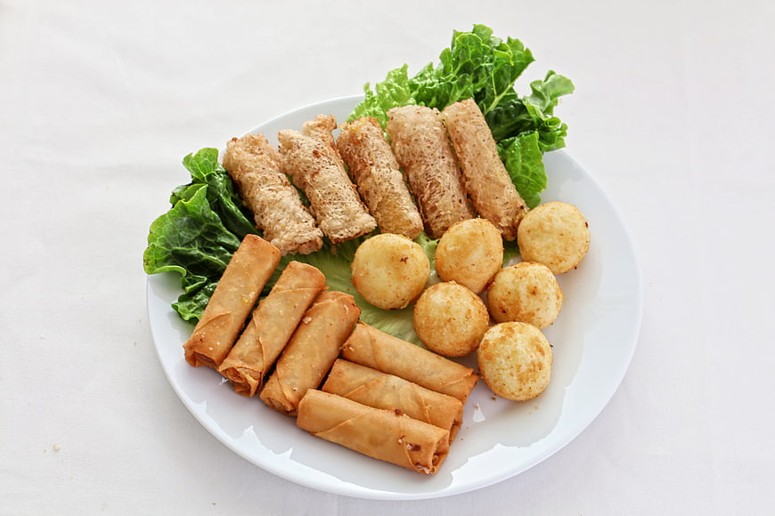 Assorted fried durian snacks on white plate