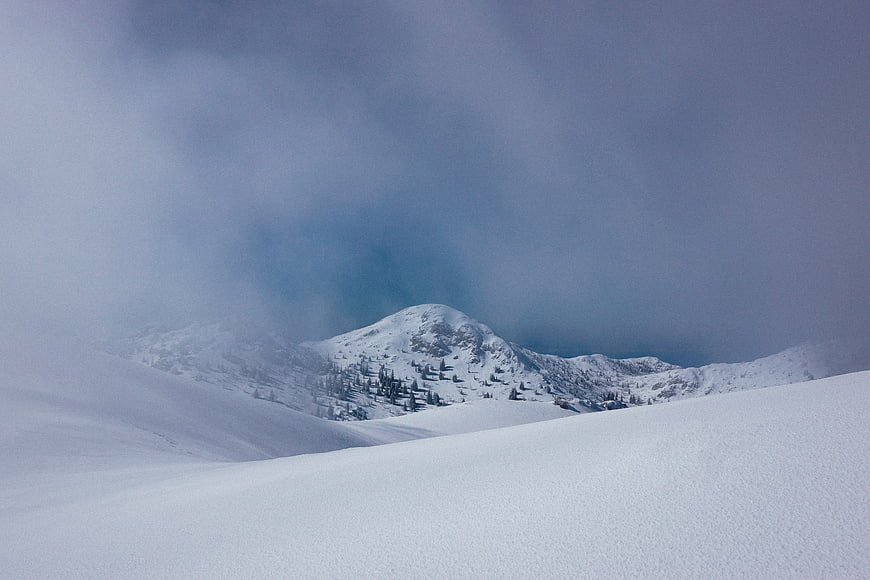 Snowy Mountain Peak in Winter Fog