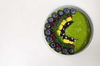 Top View Green Smoothie Bowl with Blueberries and Mango