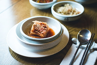 Traditional Korean Kimchi in White Ceramic Bowl