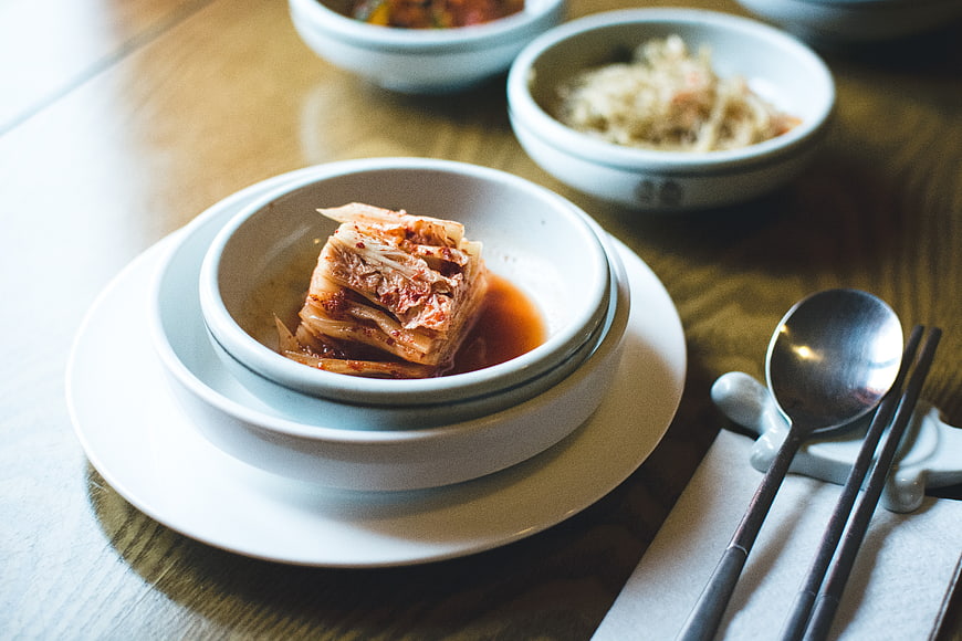 Traditional Korean Kimchi in White Ceramic Bowl