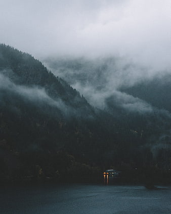 Misty Mountain Lake with Cabin Lights at Dusk