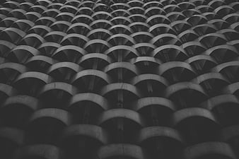 Black and white architectural pattern of curved concrete structures