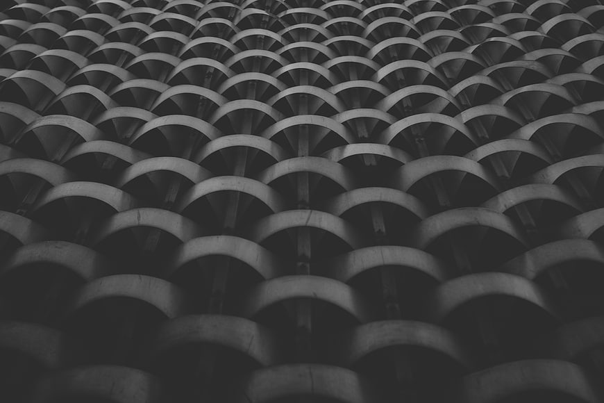 Black and white architectural pattern of curved concrete structures