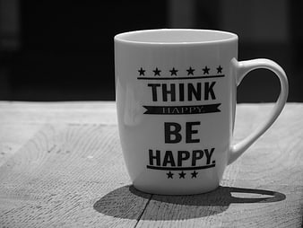 White Ceramic Mug With Think Happy Be Happy Text On Wooden Table