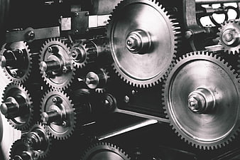 Close-up of industrial metal gears and cogs in motion