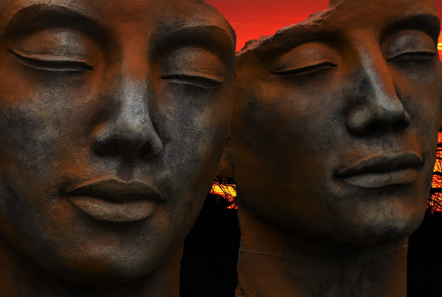 Bronze Sculpture Heads at Sunset
