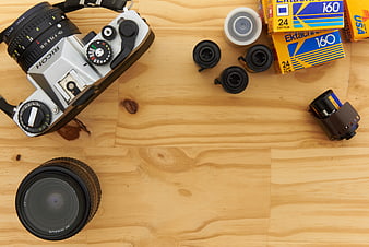 Vintage Film Camera and Accessories Flat Lay on Wooden Table