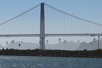 Kitesurfers under the Bay Bridge in San Francisco