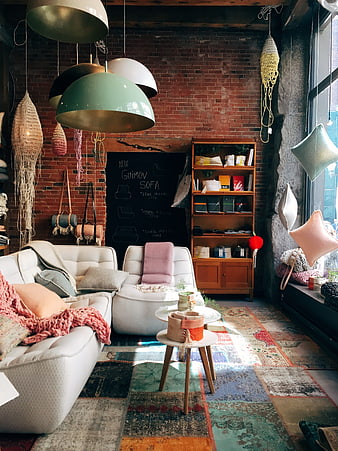 Bohemian Living Room with Brick Wall and Pastel Sofa