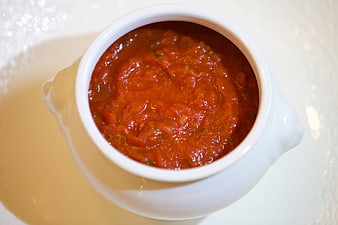 Top View of Red Tomato Sauce in White Ceramic Bowl