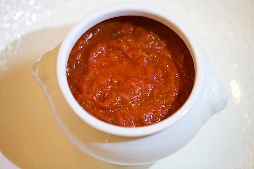 Top View of Red Tomato Sauce in White Ceramic Bowl