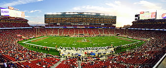 Panoramic View of Crowded American Football Stadium at Sunset