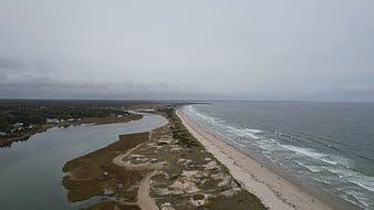 Aerial View of Coastal Barrier Island and Ocean Waves