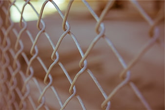 Close-up of Chain Link Fence with Blurred Background