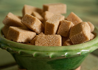 Brown Sugar Cubes In Green Ceramic Bowl