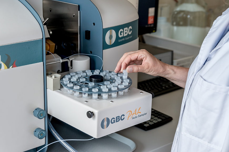 Scientist Loading Vials into GBC Auto Sampler in Laboratory
