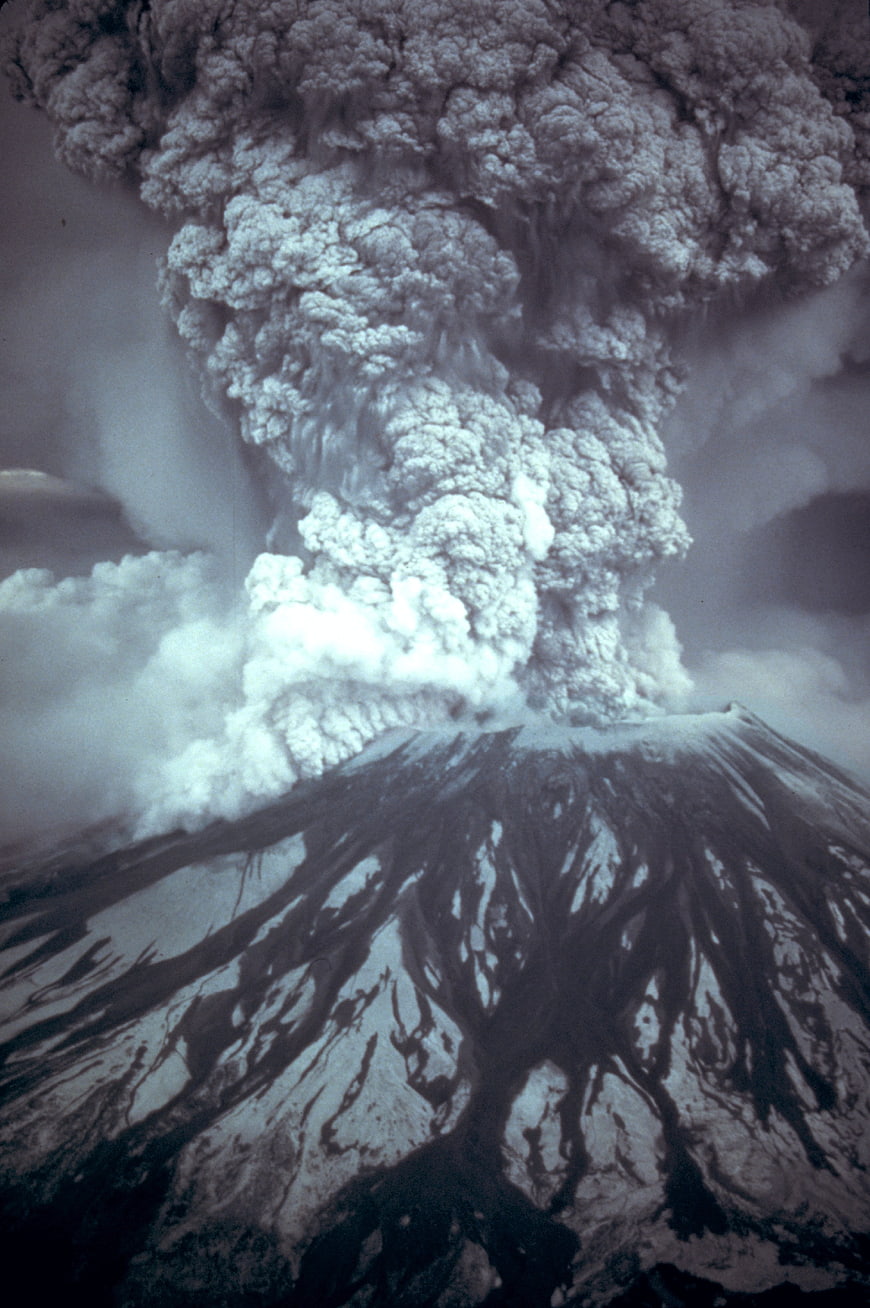 Dramatic volcanic eruption with massive ash cloud and lava flows
