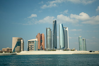Abu Dhabi Skyline with Skyscrapers and Blue Water