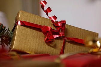 Gold Gift Box With Red Ribbon And Curl