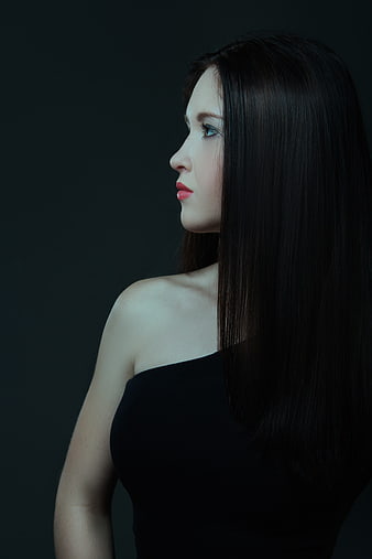 Moody Profile Portrait of Young Woman in Black Dress