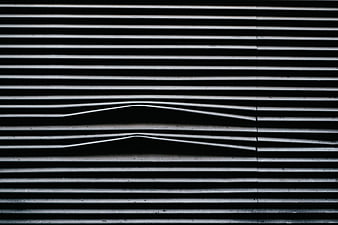 Abstract black and white horizontal blinds with distorted lines