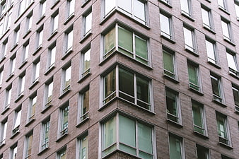 Modern Brick Apartment Building Facade with Windows