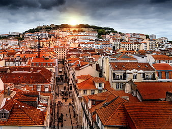 Dramatic Lisbon Cityscape with Red Roofs and Castle Hill