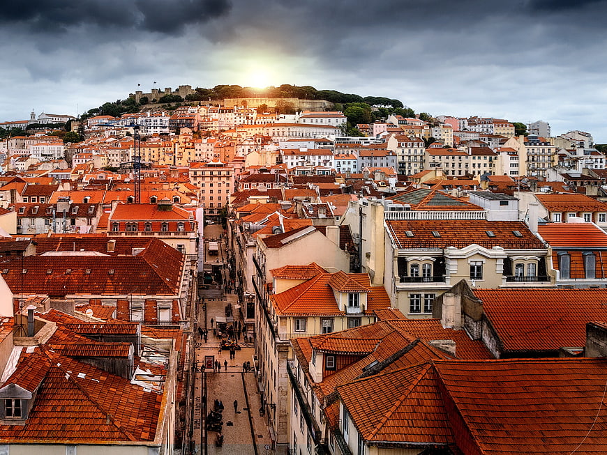 Dramatic Lisbon Cityscape with Red Roofs and Castle Hill