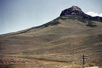 Vintage Film Photo of Arid Mountain Landscape with Utility Pole