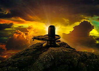 Lingam on Rocky Peak with Dramatic Golden Sky and Divine Light Rays