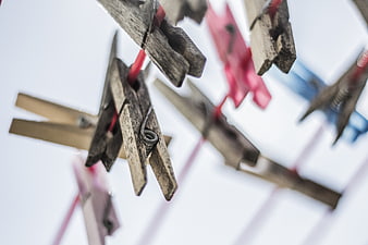 Close-up of wooden clothespins on a clothesline