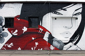 Large scale street art mural of woman in red kimono