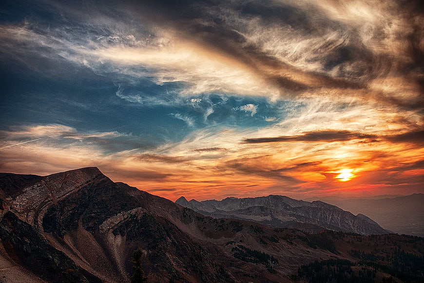 Dramatic Sunset Over Rugged Mountain Peaks