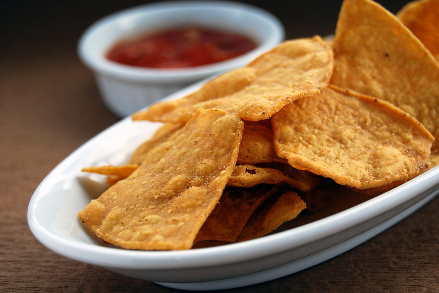 Crispy Tortilla Chips with Salsa in White Bowl