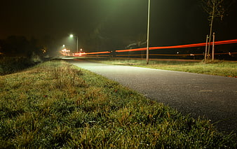 Long Exposure Night Road with Red Light Trails