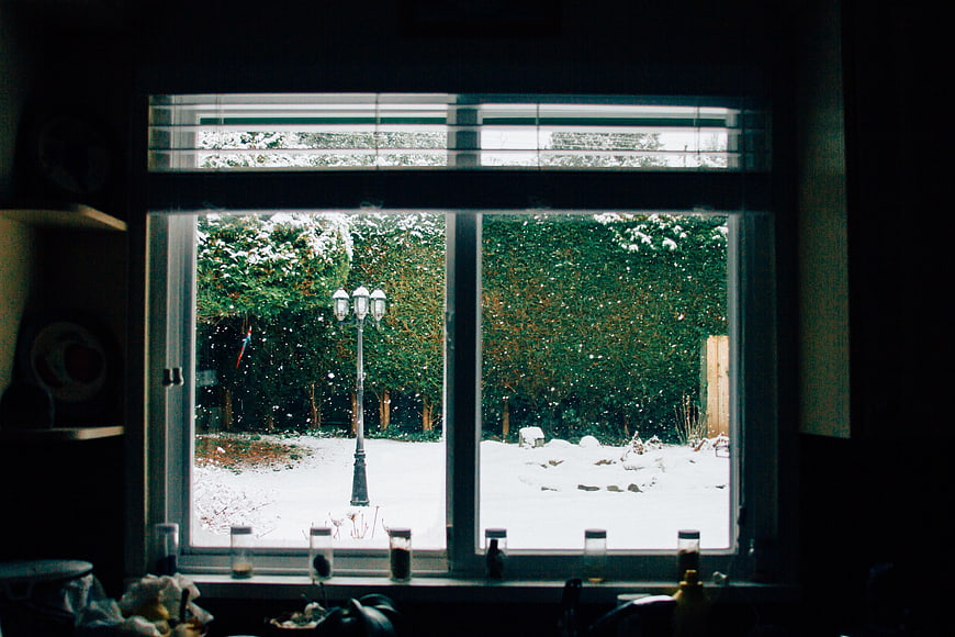 Cozy Winter View Through Window With Snowy Garden