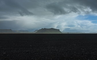 Dramatic Icelandic Landscape with Black Sand Beach and Mountain