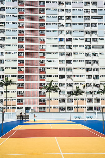 Colorful Basketball Court in Front of High-Rise Apartment Building