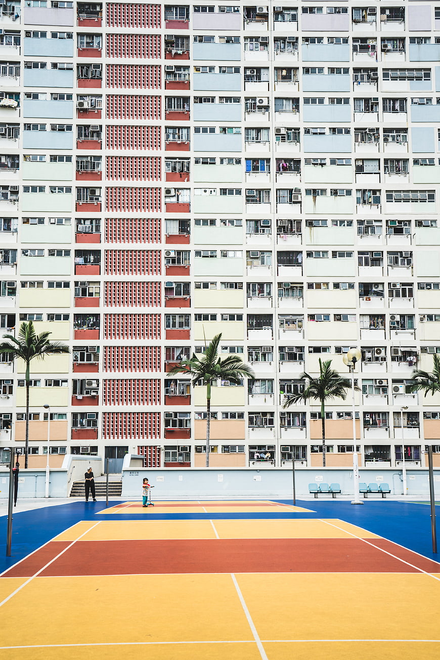 Colorful Basketball Court in Front of High-Rise Apartment Building