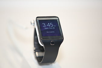 Close-up of black smartwatch on white background
