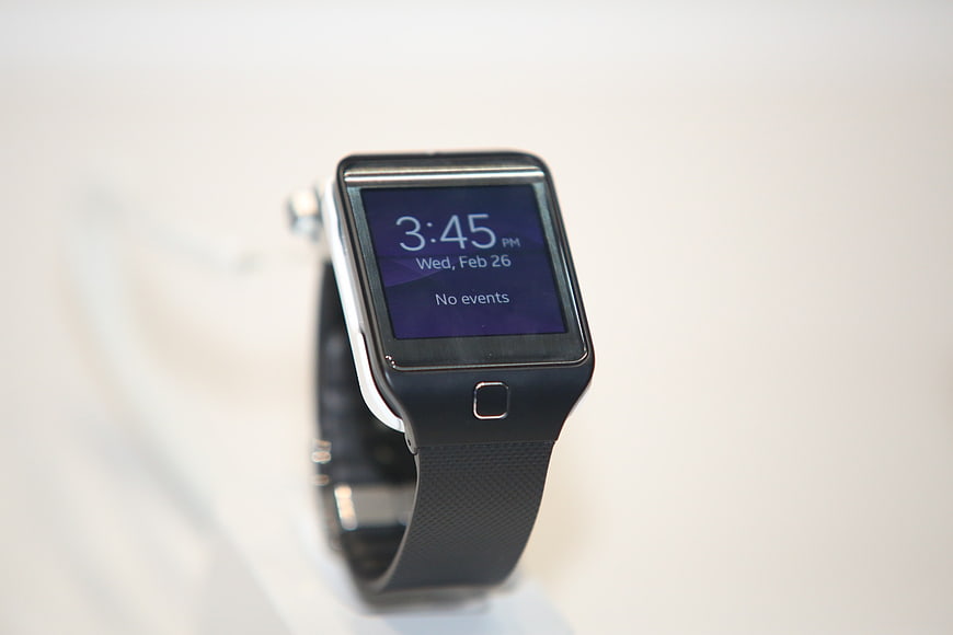 Close-up of black smartwatch on white background