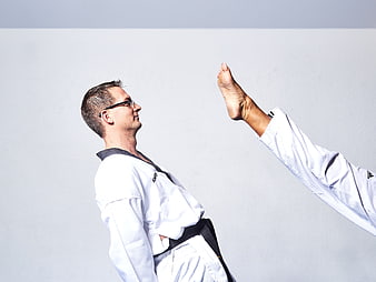 Taekwondo Instructor Demonstrating High Kick Technique