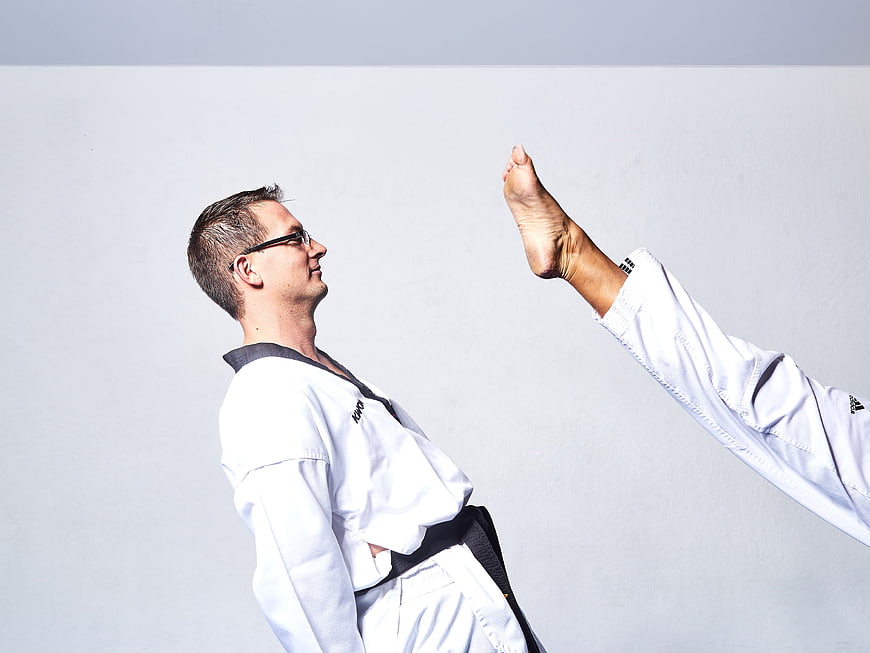 Taekwondo Instructor Demonstrating High Kick Technique