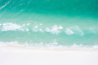 Aerial View of Turquoise Ocean Waves on White Sandy Beach